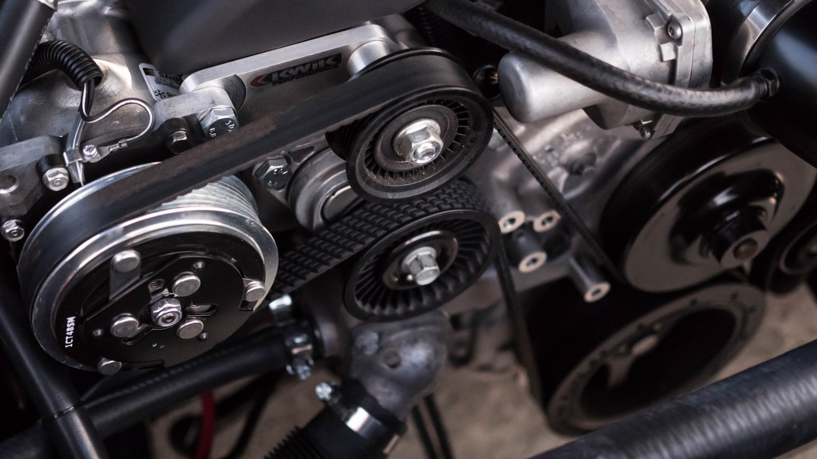 Mechanic using diagnostic tools in an engine bay